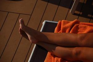 woman stretches feet relaxing photo