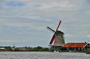 windmill on the sea shore photo