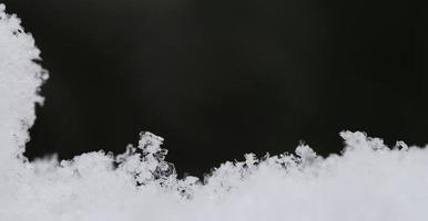 fresh snow crystals with panorama photo