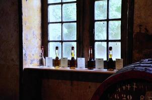 old bottles in wine cellar photo