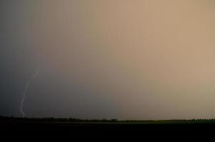 strong single lightning at field photo