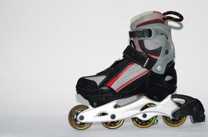 rollerskates for men in gray and red on a white photo