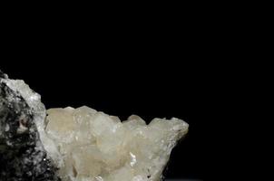 white calcite and black background photo