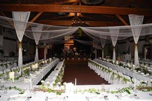 wedding with tables and stage photo