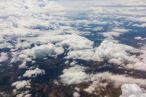 Blue sky with clouds on the airplane photo