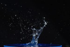 water splashes, isolated on a black background photo