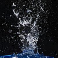 water splashes, isolated on a black background photo