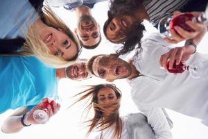 summer vacation, happy people - a group of teenagers looking down with a happy smile on his face. photo