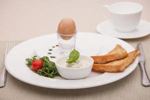 breakfast served with toast and fried bread photo