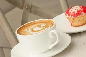 cup of coffee on the table photo