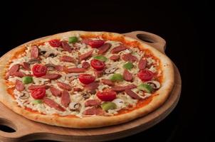 pizza on a wooden tray photo