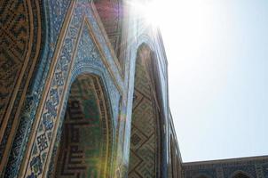 Arch and architecture of the ancient Registan in Samarkand. Ancient architecture of Central Asia photo