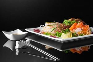 sushi in a plate on a black background photo