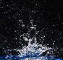 Splash water, water splashes, isolated on black background. photo