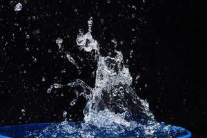 water splashes, isolated on a black background photo