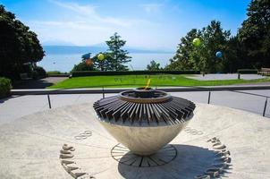 Lausanne, Switzerland - September 14, 2016 The Olympic Flame in Olympic Park in Lausanne, on the shore of the Lake Leman Lake Geneva near Olympic Museum, Swiss Riviera, Switzerland photo