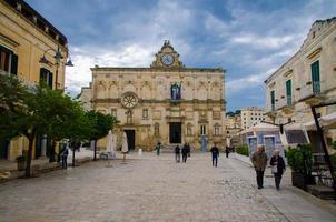 Matera, Italy - May 6, 2018 National Museum of Medieval Modern Art with clock Pascoli Museo Nazionale Arte Medievale e Moderna della Basilicata on Piazza Giovanni square with dramatic sky photo