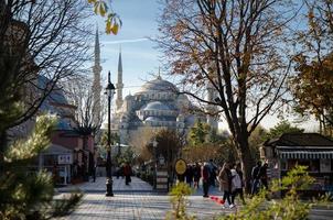 Istanbul, Turkey, November 25, 2017 People walking near Sultan Ahmet Camii named Blue Mosque photo