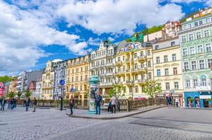 Karlovy Vary, Czech Republic, May 10, 2019 people are walking down street and Tepla river embankment in Carlsbad photo