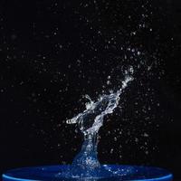 Blue water drops falling down. photo