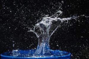 water splashes, isolated on a black background photo