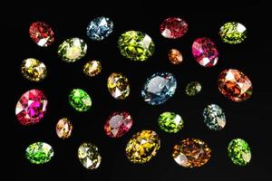 Colorful Round gems diamonds isolated on black background 3d rendering