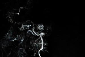Smoke effect texture. Isolated background. Black and dark backdrop. Smokey fire and mistic effect. photo