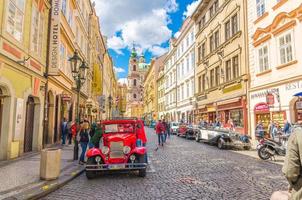 Prague, Czech Republic, May 13, 2019 old retro vintage car on cobblestone street in Lesser Town photo