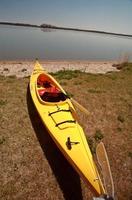 Kayak on beach at Lake Winnipeg photo