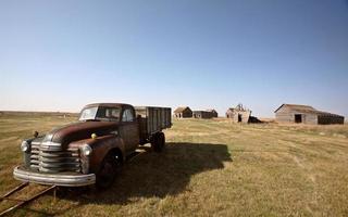 Antique Chevy farm truck in old farmyard photo