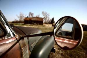 Antique Chevy farm truck in old farmyard photo
