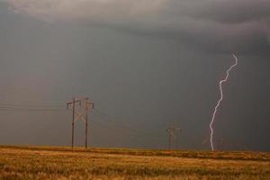 Lightning striking behind Saskatchewan power line photo