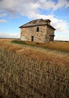 Abandoned stone house in scenic Saskatchewan photo