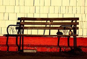 Old bench against old building photo