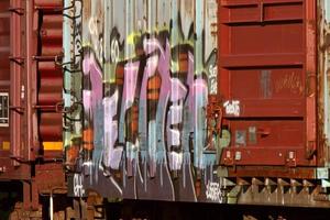 Grafetti painted on parked boxcar photo