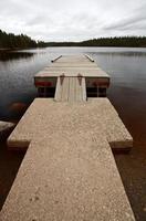 Boat dock on Northern Manitoba lake photo