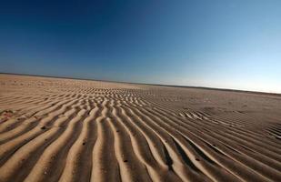 Sand flats along shore of Lake Winnipeg photo