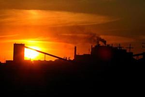 Sun setting behind Mosaic Potash Mine in Saskatchewan photo