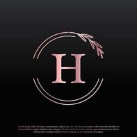 elegante logotipo floral del círculo de letras h con línea de rama de monograma de hoja elegante creativa y color negro rosa. utilizable para logotipos de negocios, moda, cosméticos, spa, ciencia, medicina y naturaleza. vector