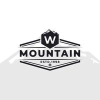 Vintage Emblem Badge Letter W Mountain Typography Logo for Outdoor Adventure Expedition, Mountains Silhouette Shirt, Print Stamp Design Template Element vector