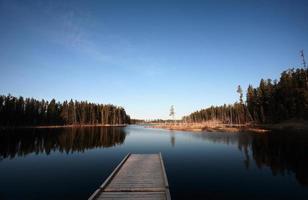 Dock on Northern Manitoba lake photo