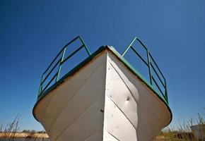 Beached fishing boat photo