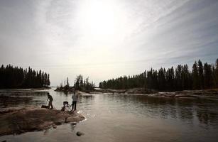 fisherrmen above Pisew Falls in Northern Manitoba photo