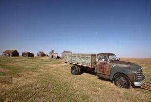 Antique Chevy farm truck in old farmyard photo