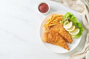 Homemade Breaded Weiner Schnitzel with Potato Chips photo