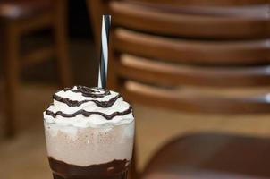 cold cocktail in a glass with a straw photo