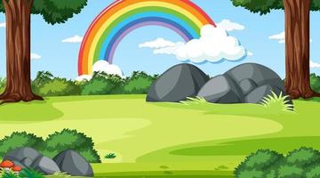 escena del bosque natural con arco iris en el cielo vector