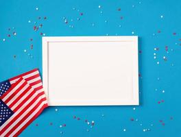 USA independence day party elements top view flat lay on blue with frame for mockup photo