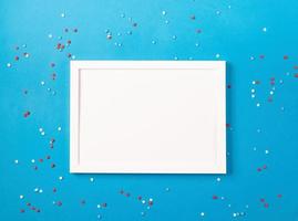 USA independence day party elements top view flat lay on blue with frame for mockup photo