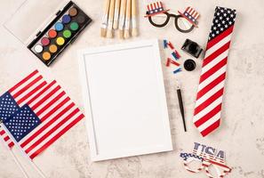 Blank frame for mockup design with USA independence day party elements top view flat lay photo